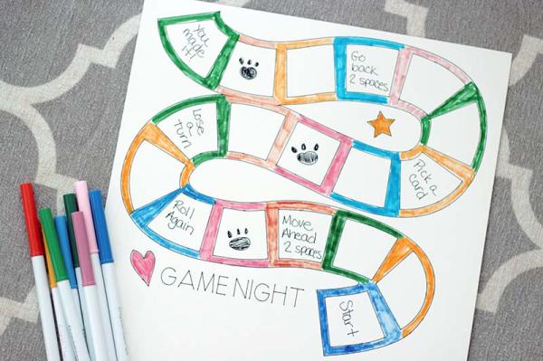 A hand-drawn board game with a winding path and coloured spaces.